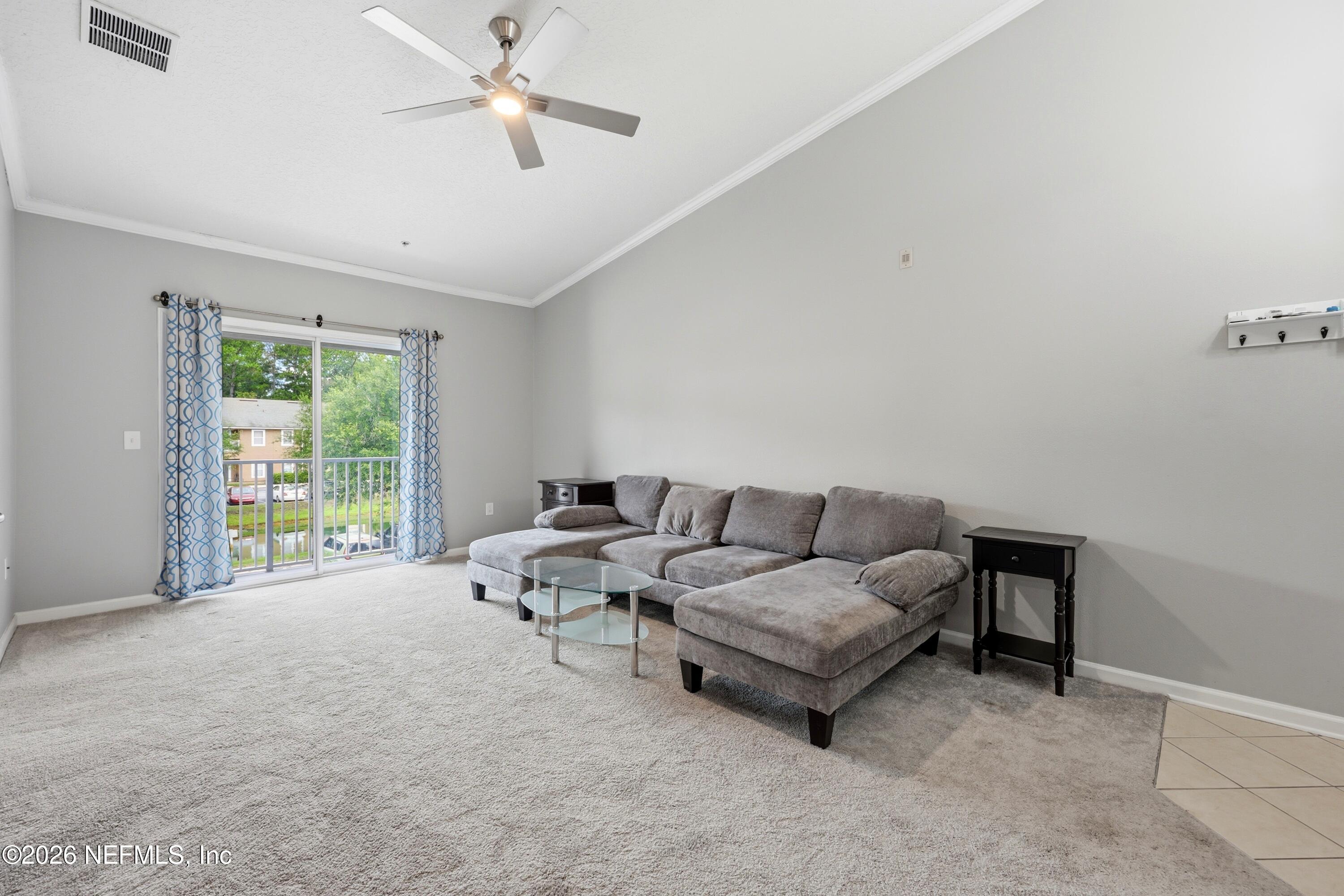 7920 Merrill Road, Unit 411 Jacksonville, FL 32277 - Photo 9 of 36 Vaulted Ceiling in Family Room