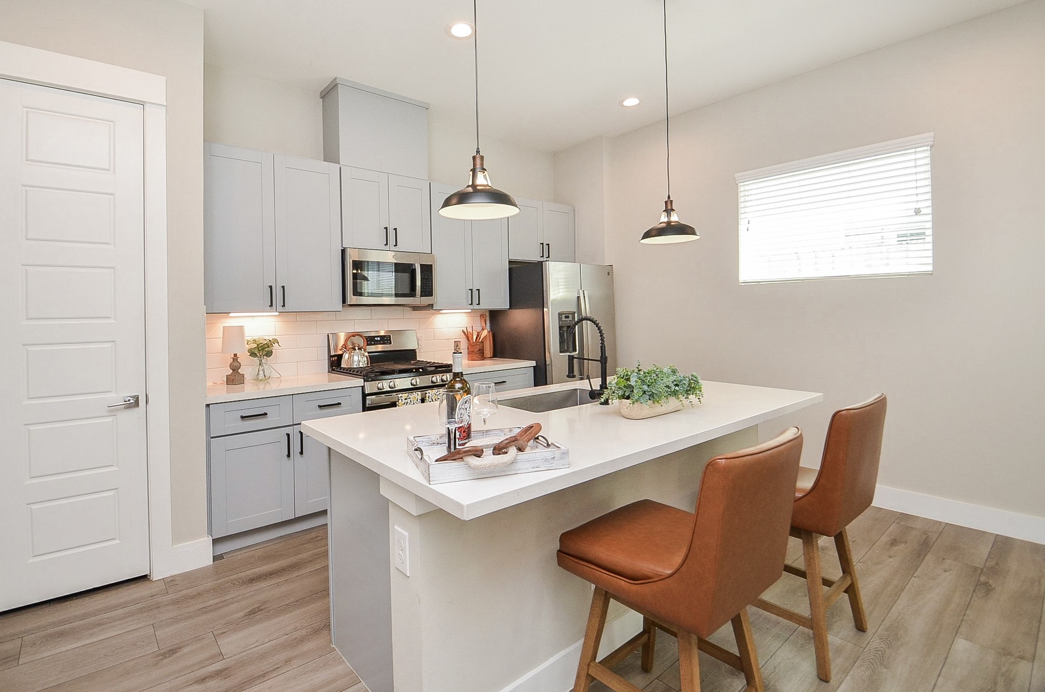 1223 West Tidwell Road Houston, TX 77091 - Photo 14 of 30 Experience culinary creativity in this modern kitchen, featuring a spacious center island perfect for additional prep space and casual dining.