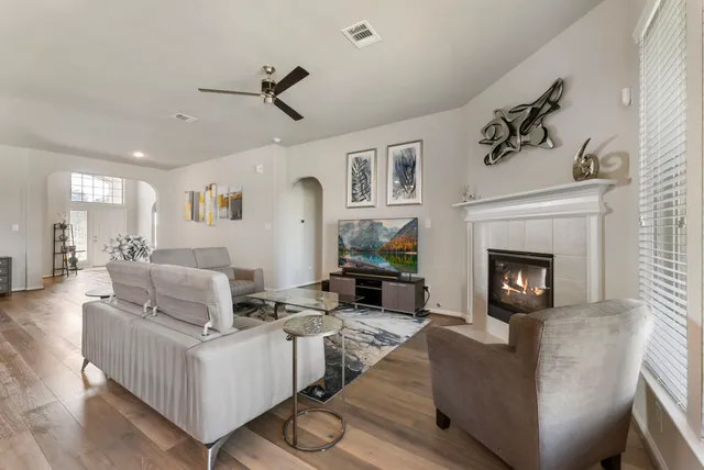 a living room with furniture and a fireplace