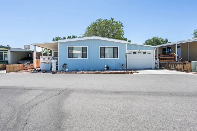 a view of a terrace with a flat screen tv and couches