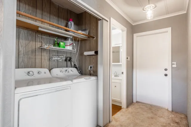 a view of storage and utility room with washer and dryer