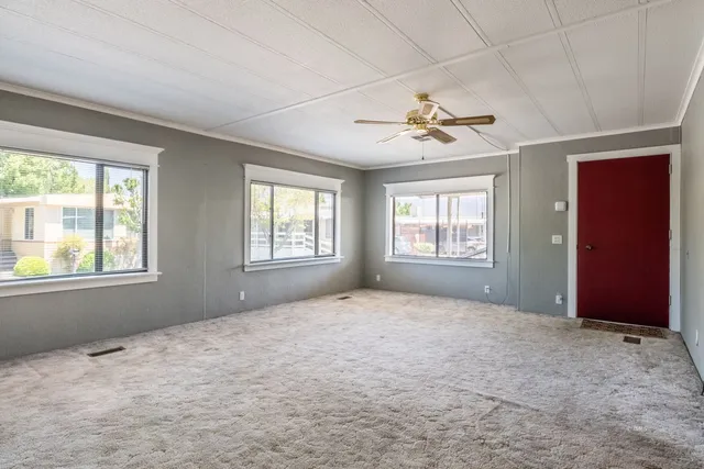 a view of an empty room with a window
