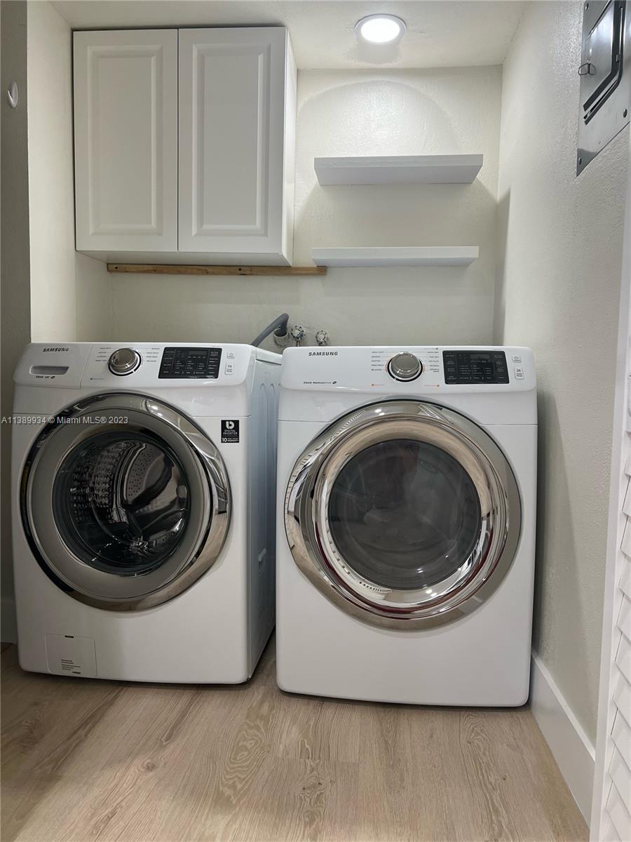491 Racquet Club Road, Unit 312 Weston, FL 33326 - Photo 7 of 7 a utility room with washing machine