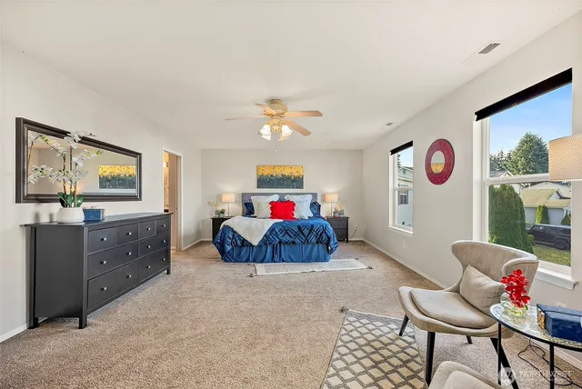 a bed room with a bed and a chandelier