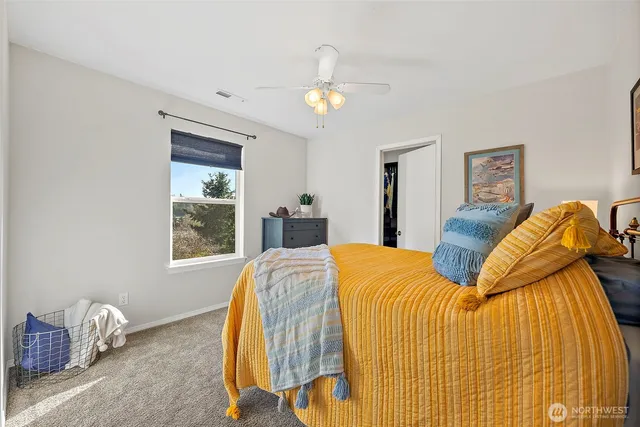 a bed room with a bed and a chandelier