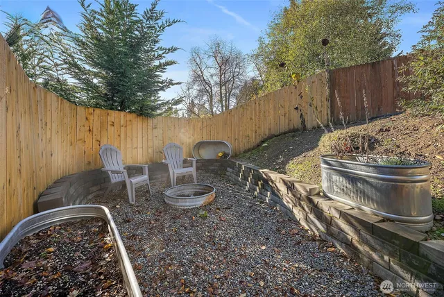 a view of a backyard with sitting area