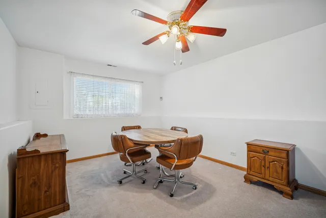 a workspace with furniture and a window