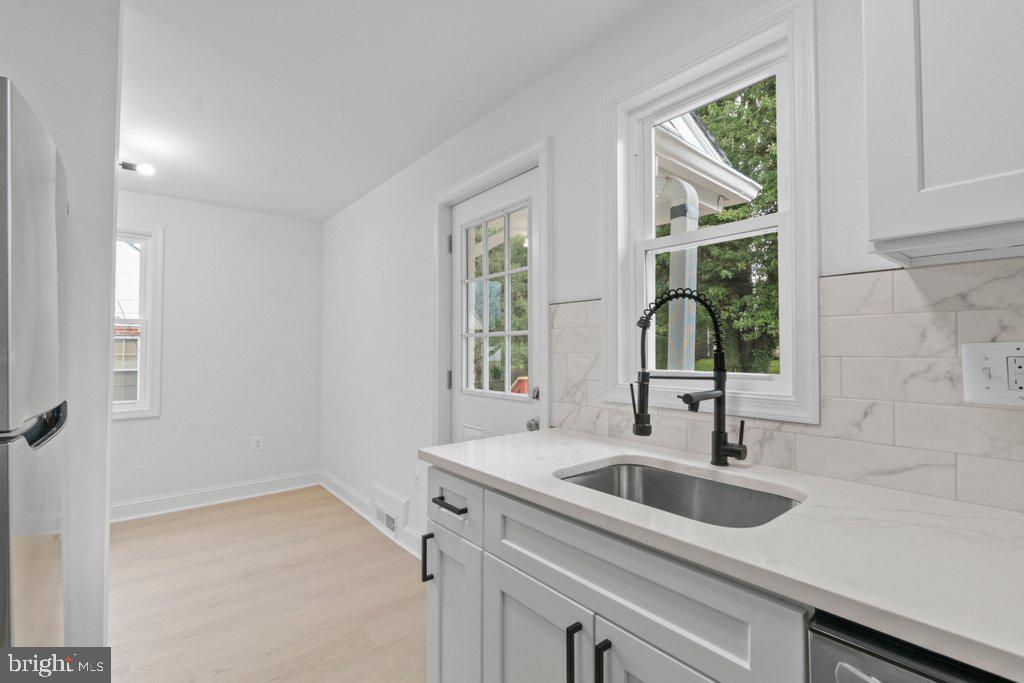3491 Hillsmere Road Baltimore, MD 21207 - Photo 14 of 40 a kitchen that has a sink and a window