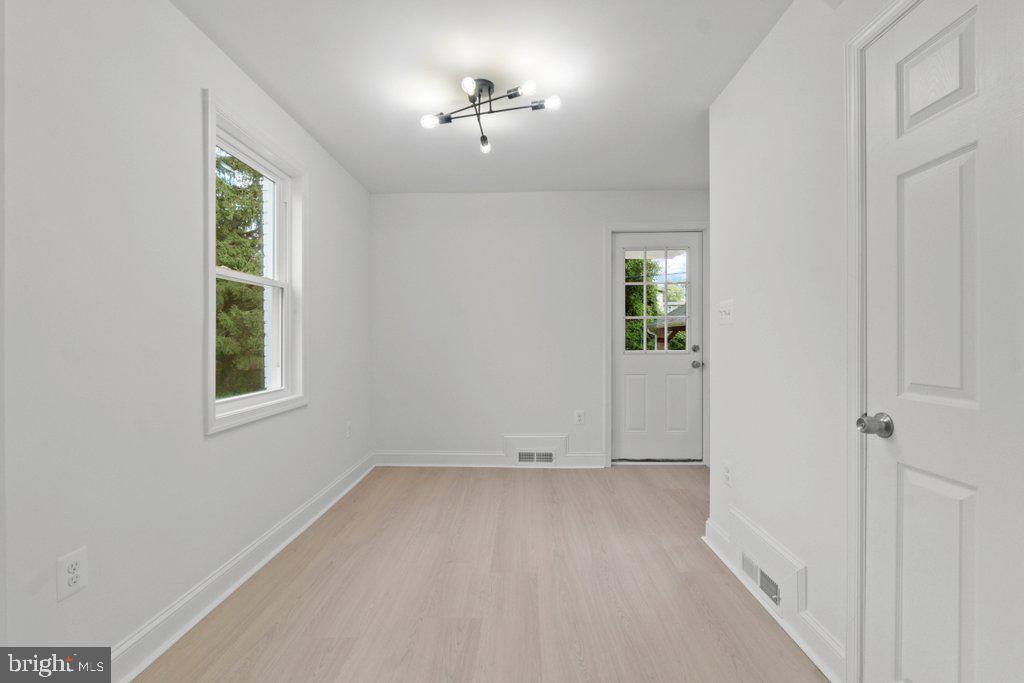3491 Hillsmere Road Baltimore, MD 21207 - Photo 8 of 40 an empty room with windows