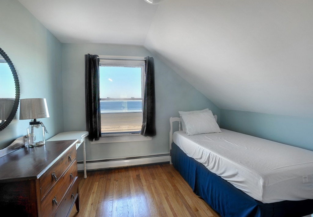 69 Beach Avenue Hull, MA 02045 - Photo 12 of 27 a bedroom with a bed and a desk