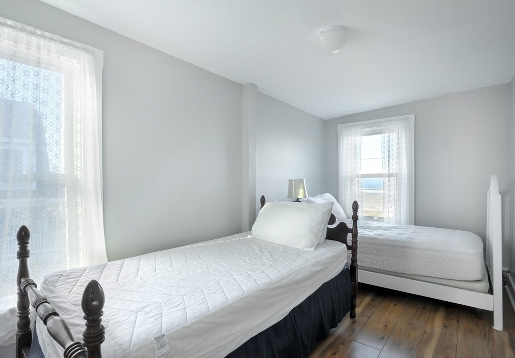 69 Beach Avenue Hull, MA 02045 - Photo 15 of 27 a bedroom with a bed and a window
