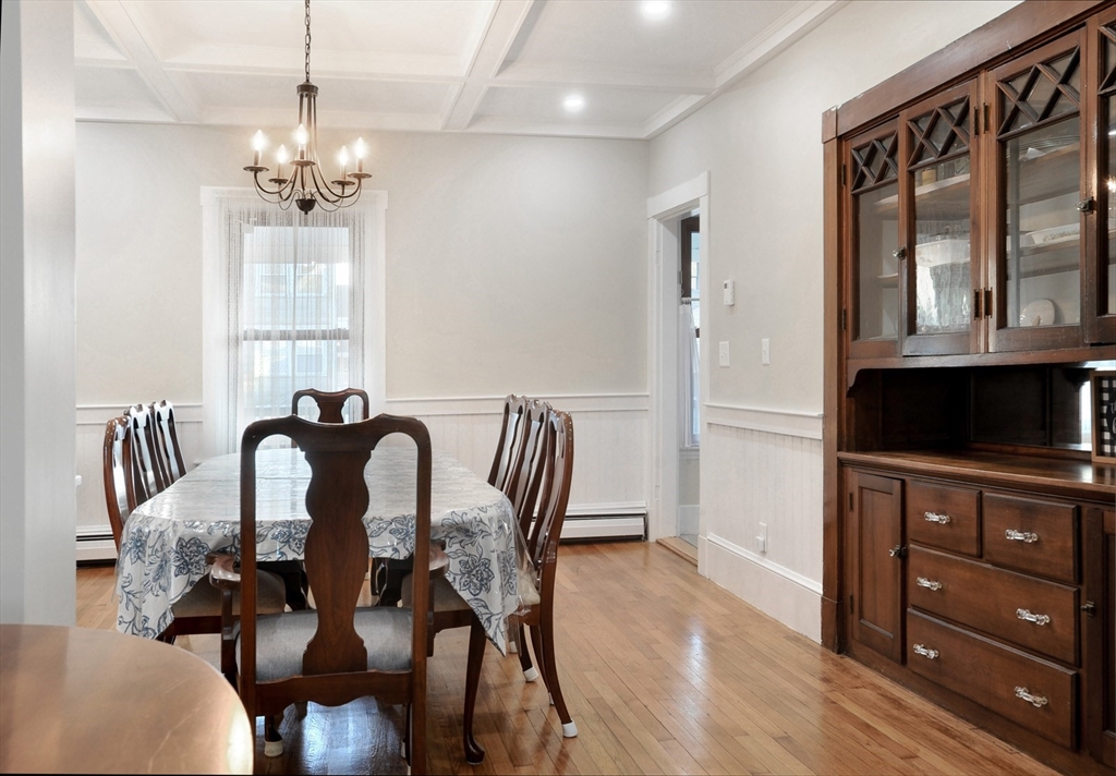 69 Beach Avenue Hull, MA 02045 - Photo 21 of 27 a view of a dining room with furniture and chandelier