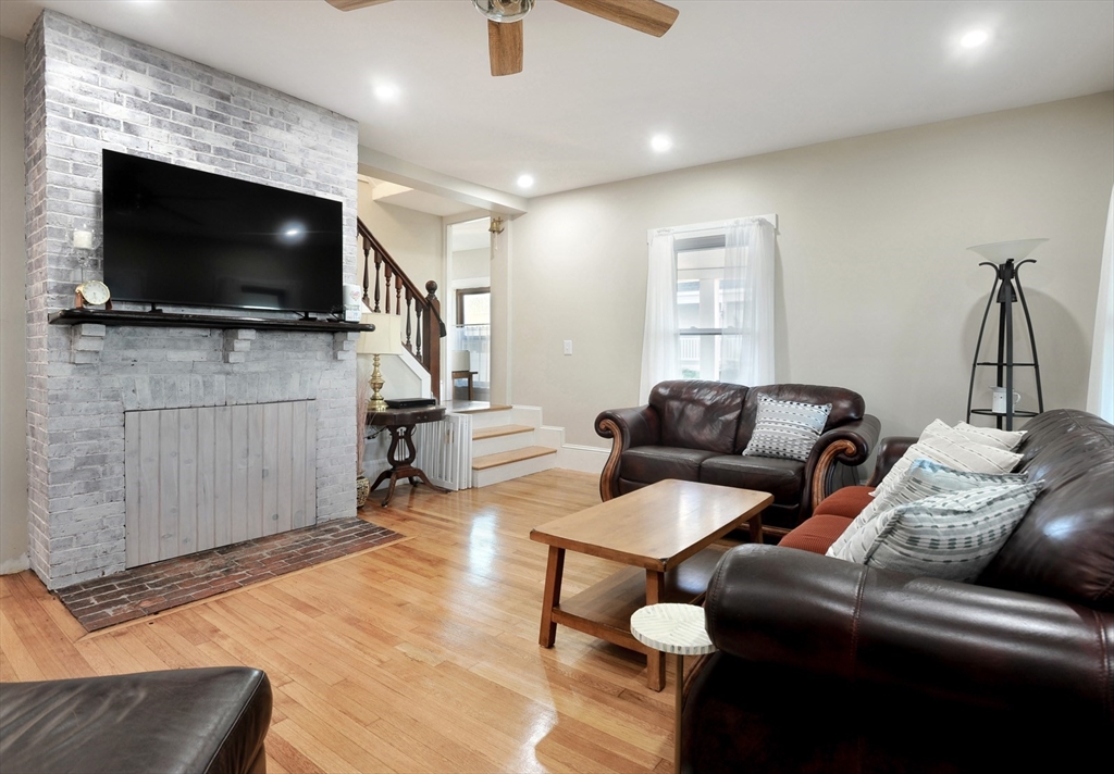69 Beach Avenue Hull, MA 02045 - Photo 25 of 27 a living room with furniture and a flat screen tv
