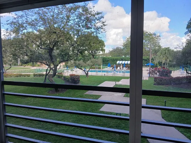 a view of a bench in front of a building
