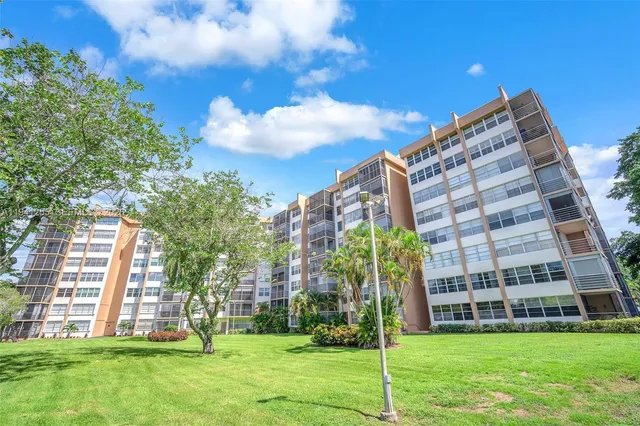 a view of a building with a yard