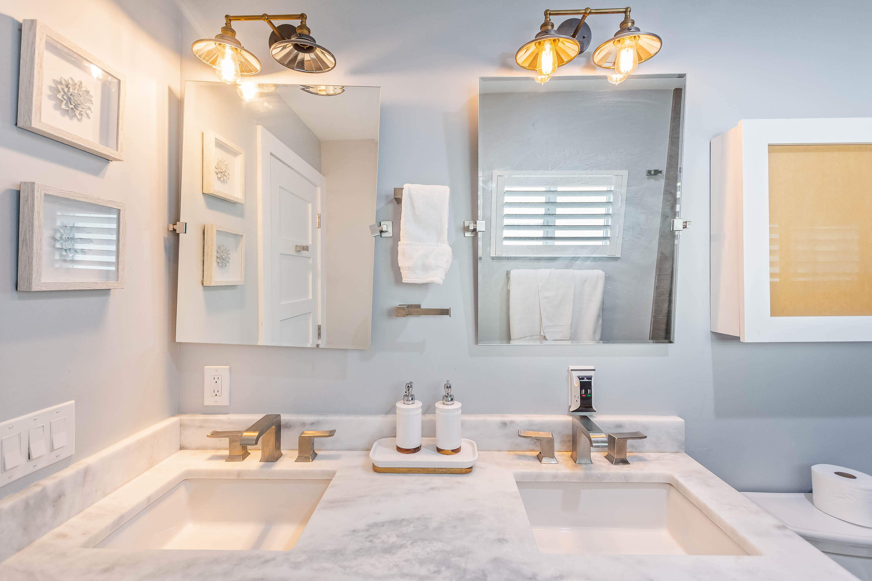 2830 Southwest 5th Street Boynton Beach, FL 33435 - Photo 12 of 26 a bathroom with a sink mirror and vanity