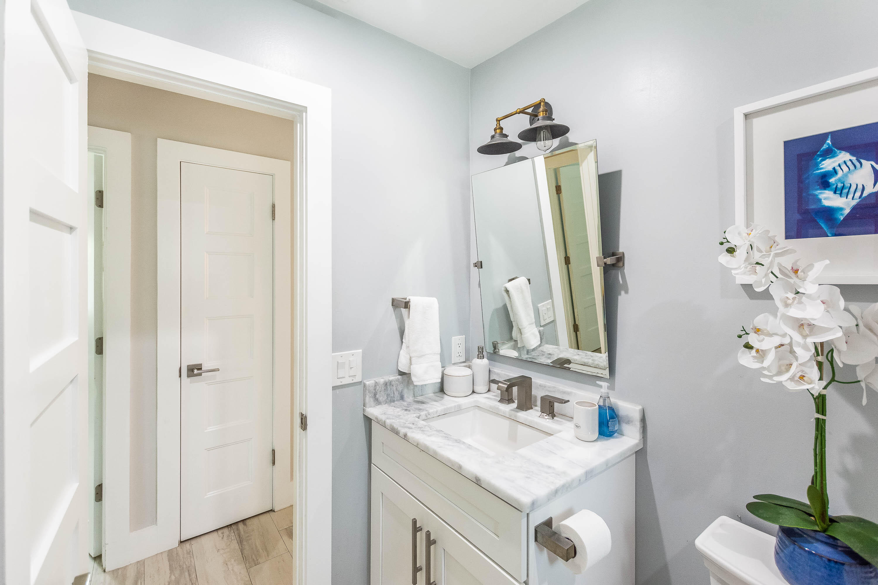 2830 Southwest 5th Street Boynton Beach, FL 33435 - Photo 14 of 26 a bathroom with a sink vanity granite and a mirror
