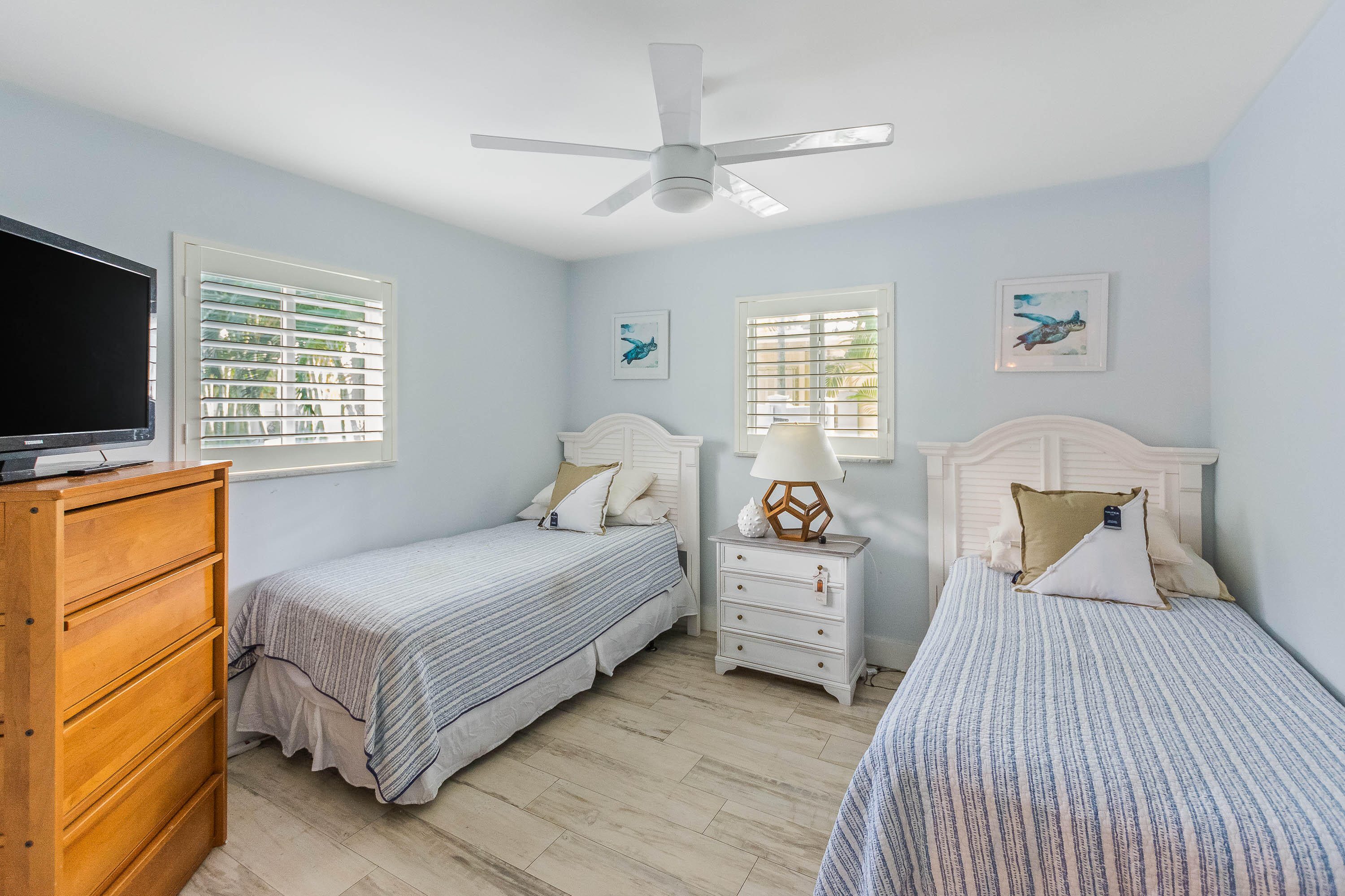 2830 Southwest 5th Street Boynton Beach, FL 33435 - Photo 15 of 26 a bedroom with two beds and a window