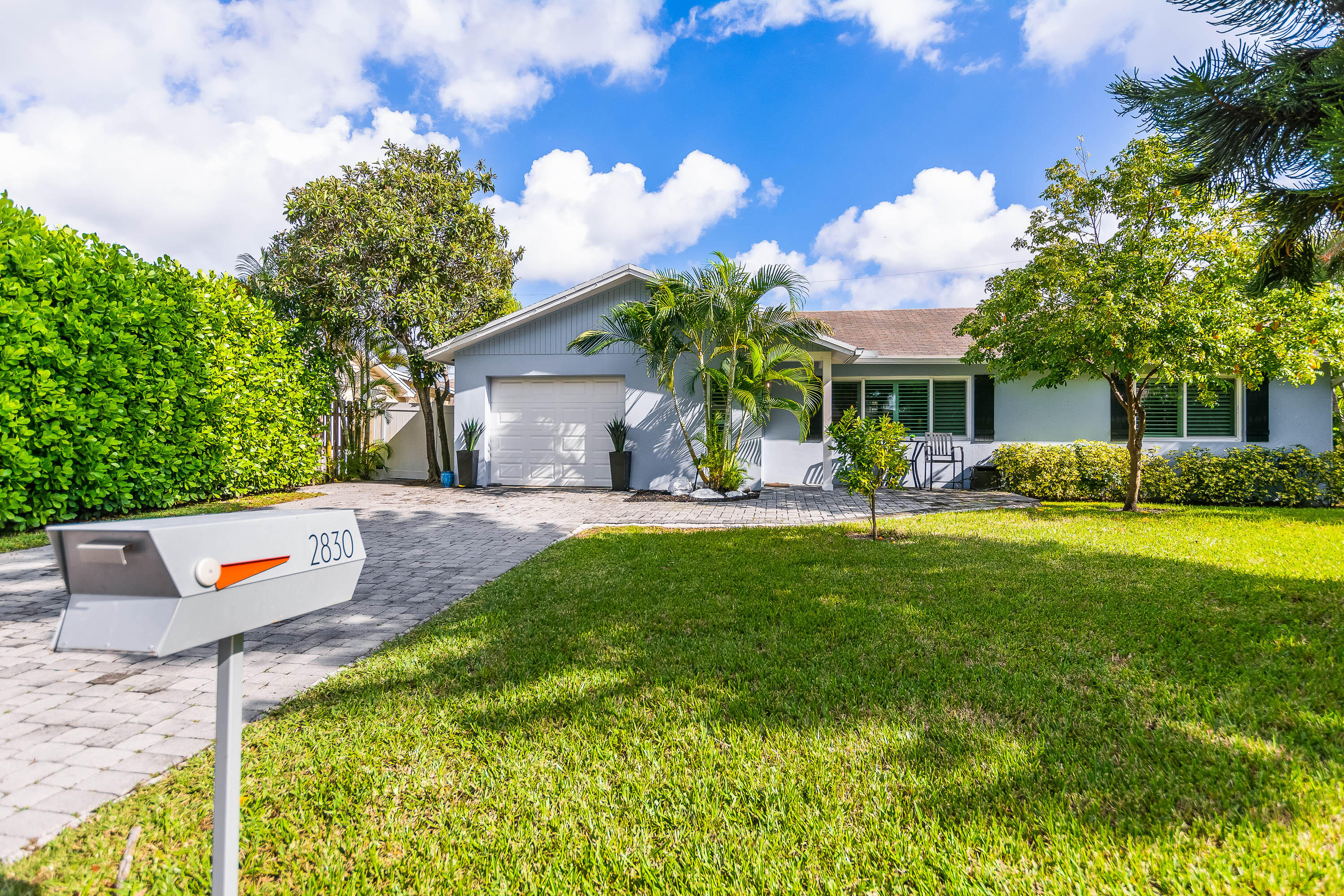 2830 Southwest 5th Street Boynton Beach, FL 33435 - Photo 25 of 26 a view of a house with a backyard porch and sitting area