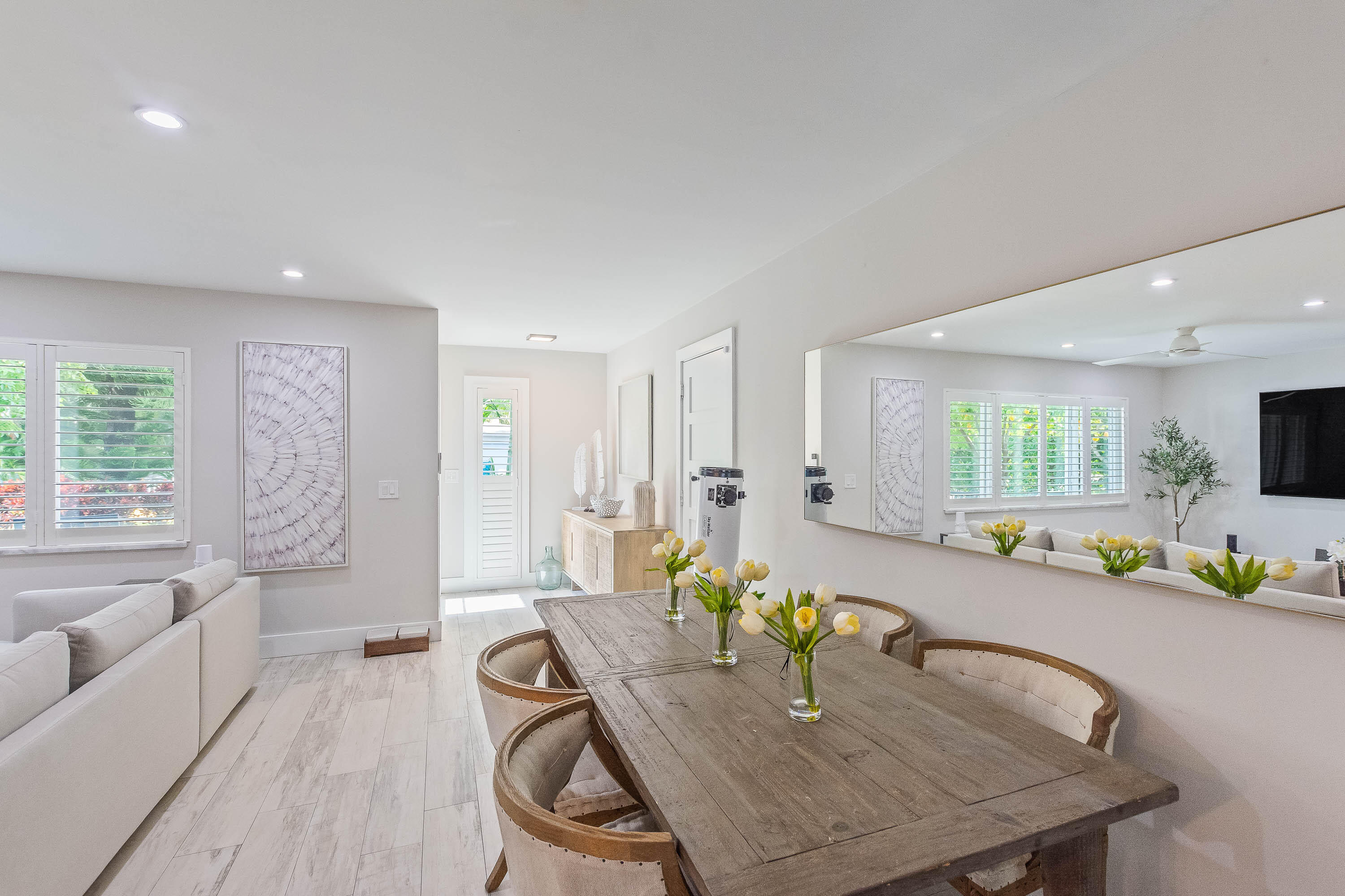 2830 Southwest 5th Street Boynton Beach, FL 33435 - Photo 3 of 26 a dining room with furniture and a kitchen view