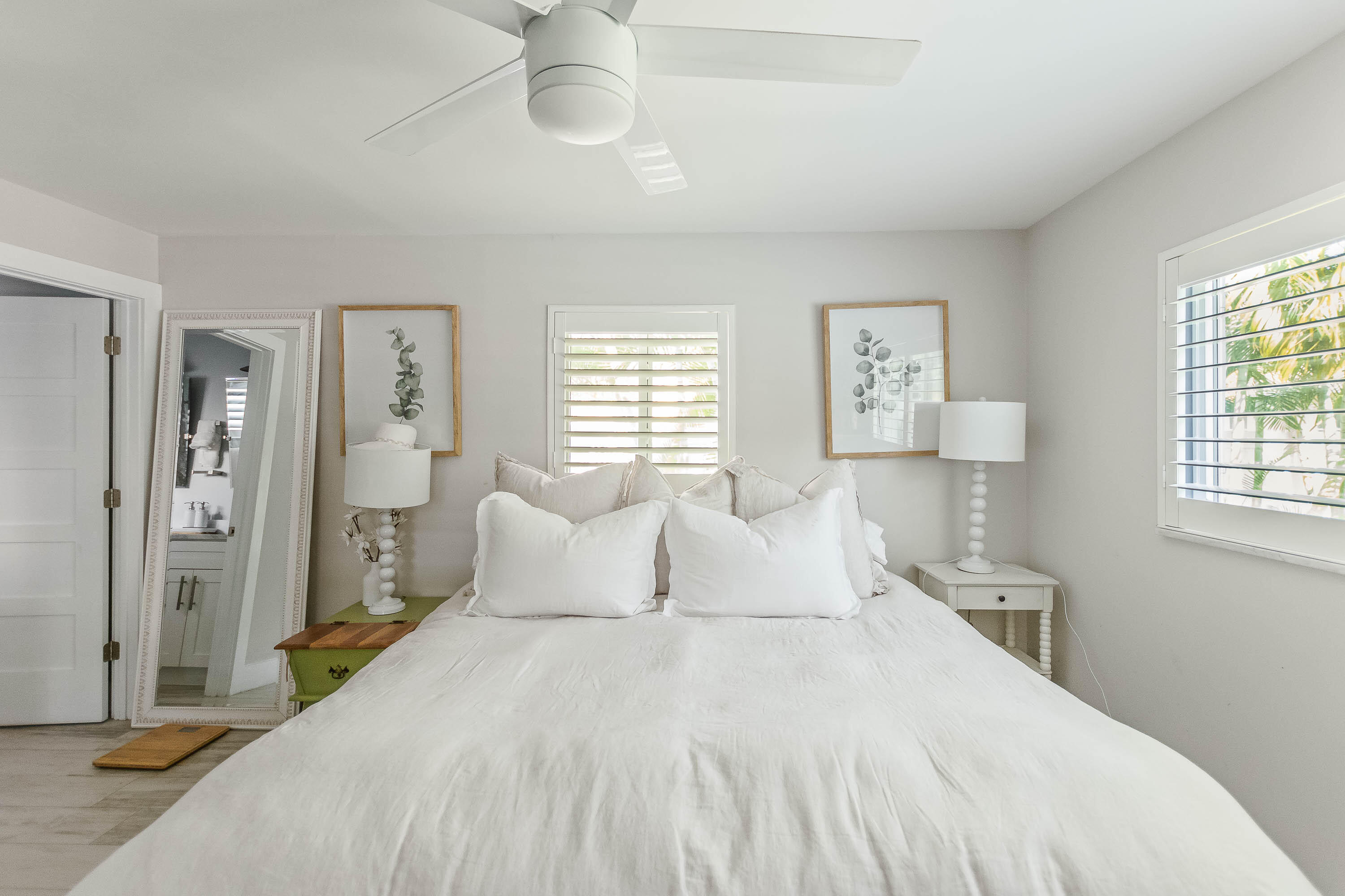 2830 Southwest 5th Street Boynton Beach, FL 33435 - Photo 9 of 26 a bedroom with a large bed and a chandelier