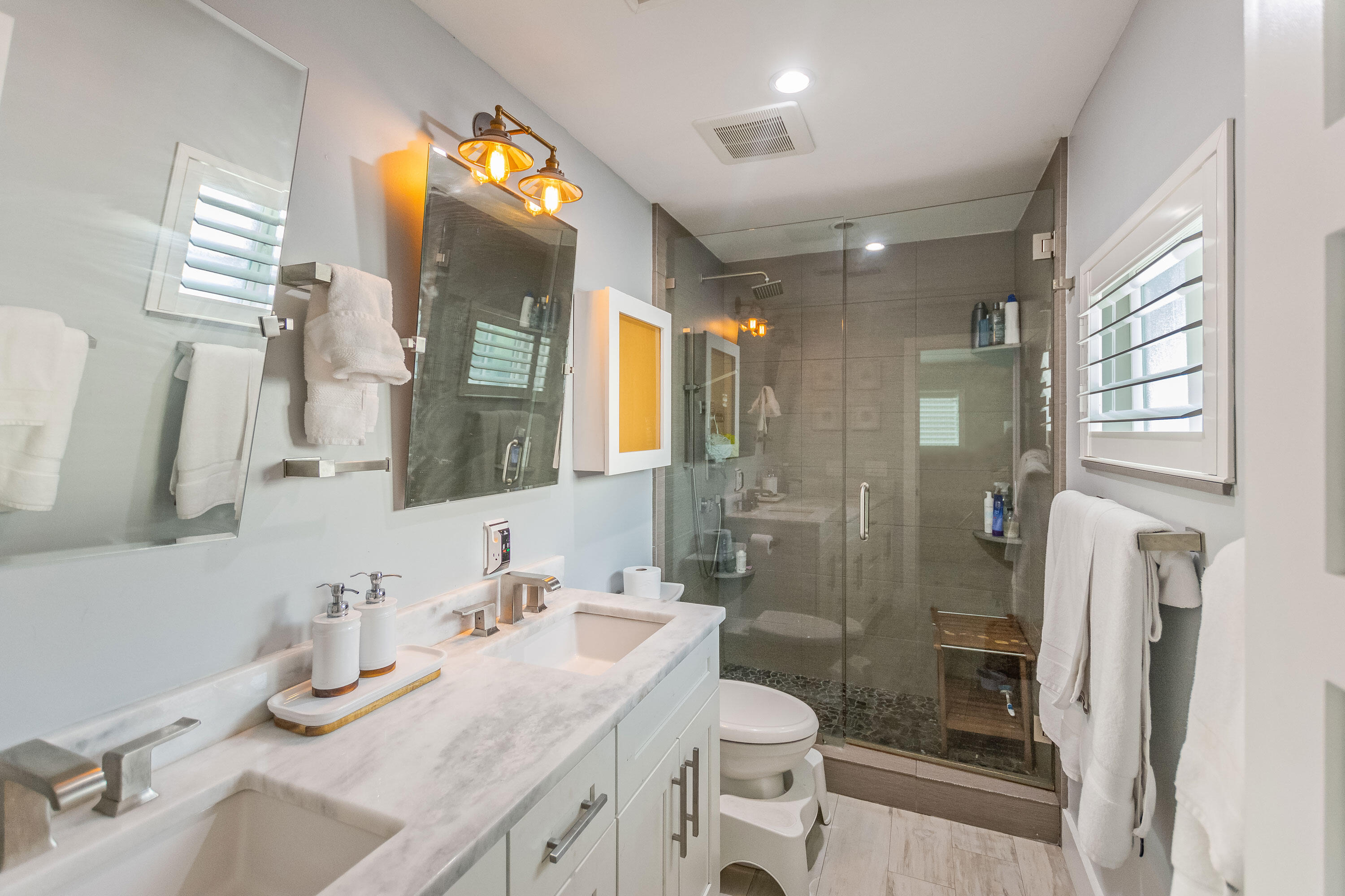 2830 Southwest 5th Street Boynton Beach, FL 33435 - Photo 10 of 26 a bathroom with a granite countertop sink toilet and shower