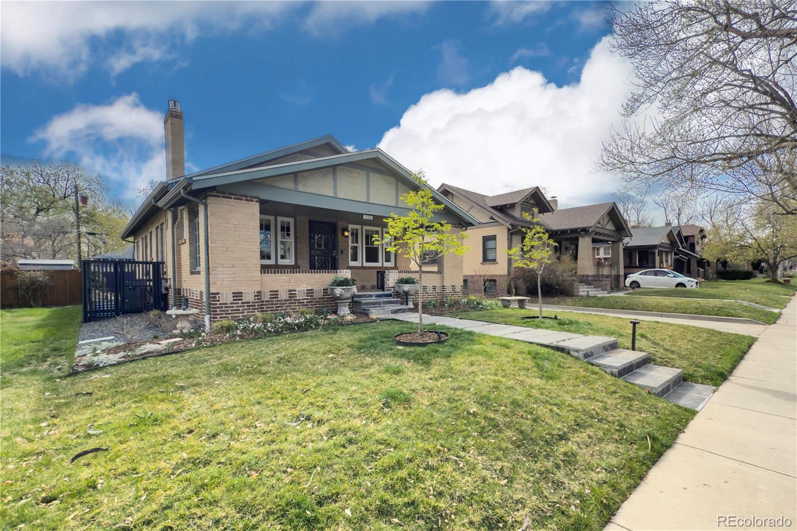 926 Steele Street Denver, CO 80206 - Photo 2 of 41 a view of house with swimming pool and a yard