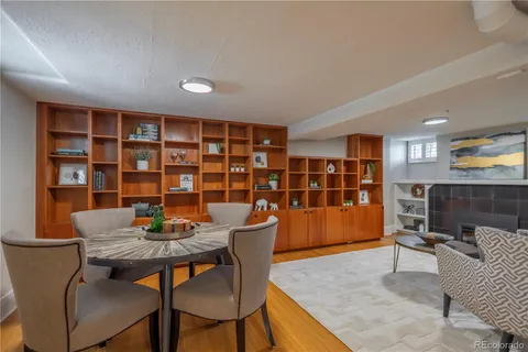 a dining room with furniture and window