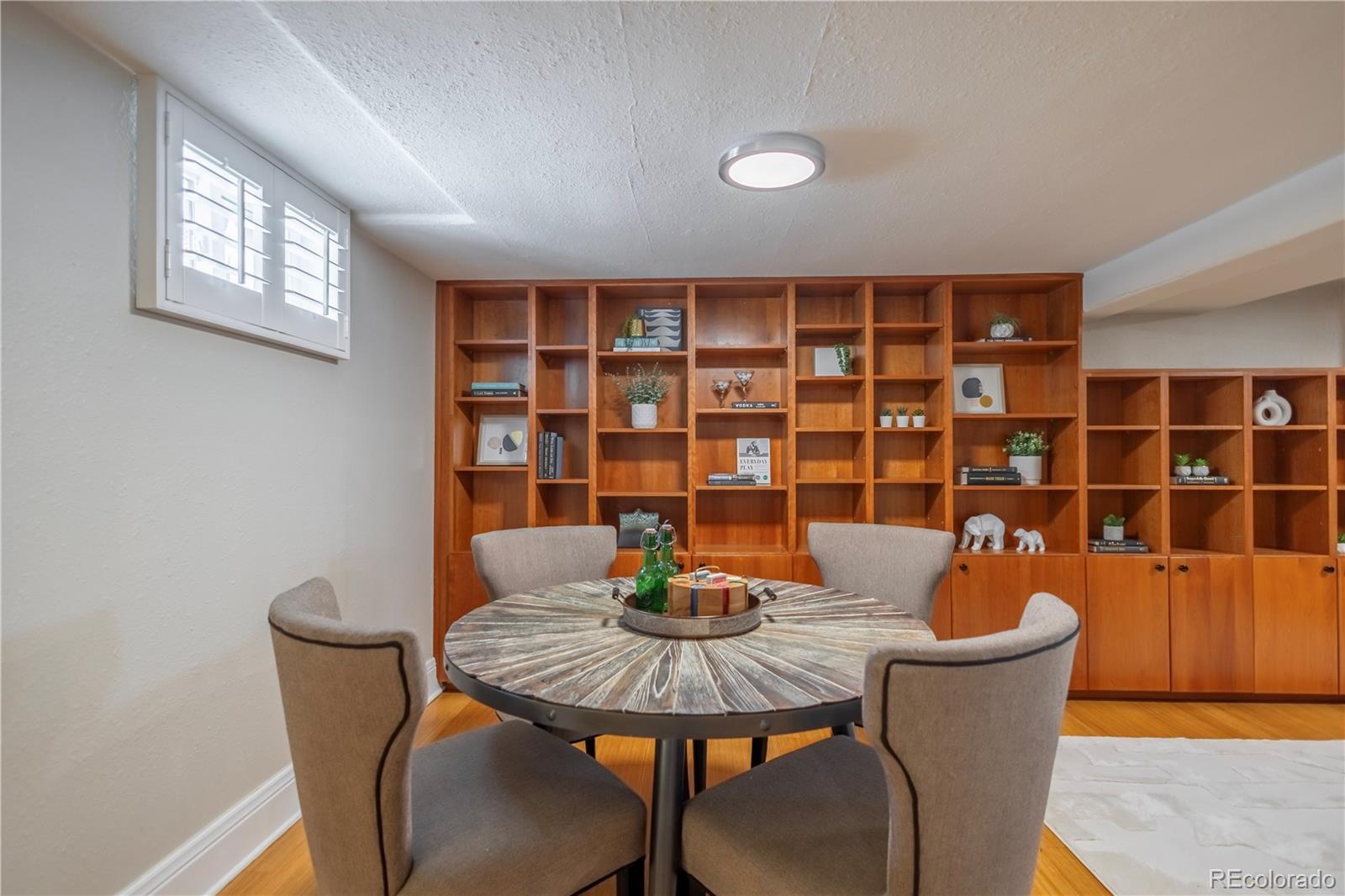 926 Steele Street Denver, CO 80206 - Photo 28 of 41 a dining room with furniture and window
