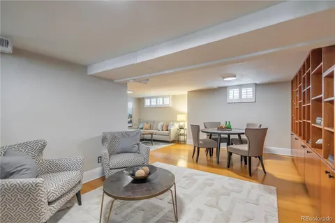 a living room with furniture and a painting