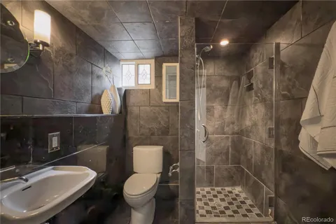 a utility room with dryer washer and racks