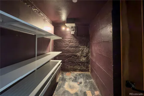 a view of a patio with table and chairs with wooden floor and fence