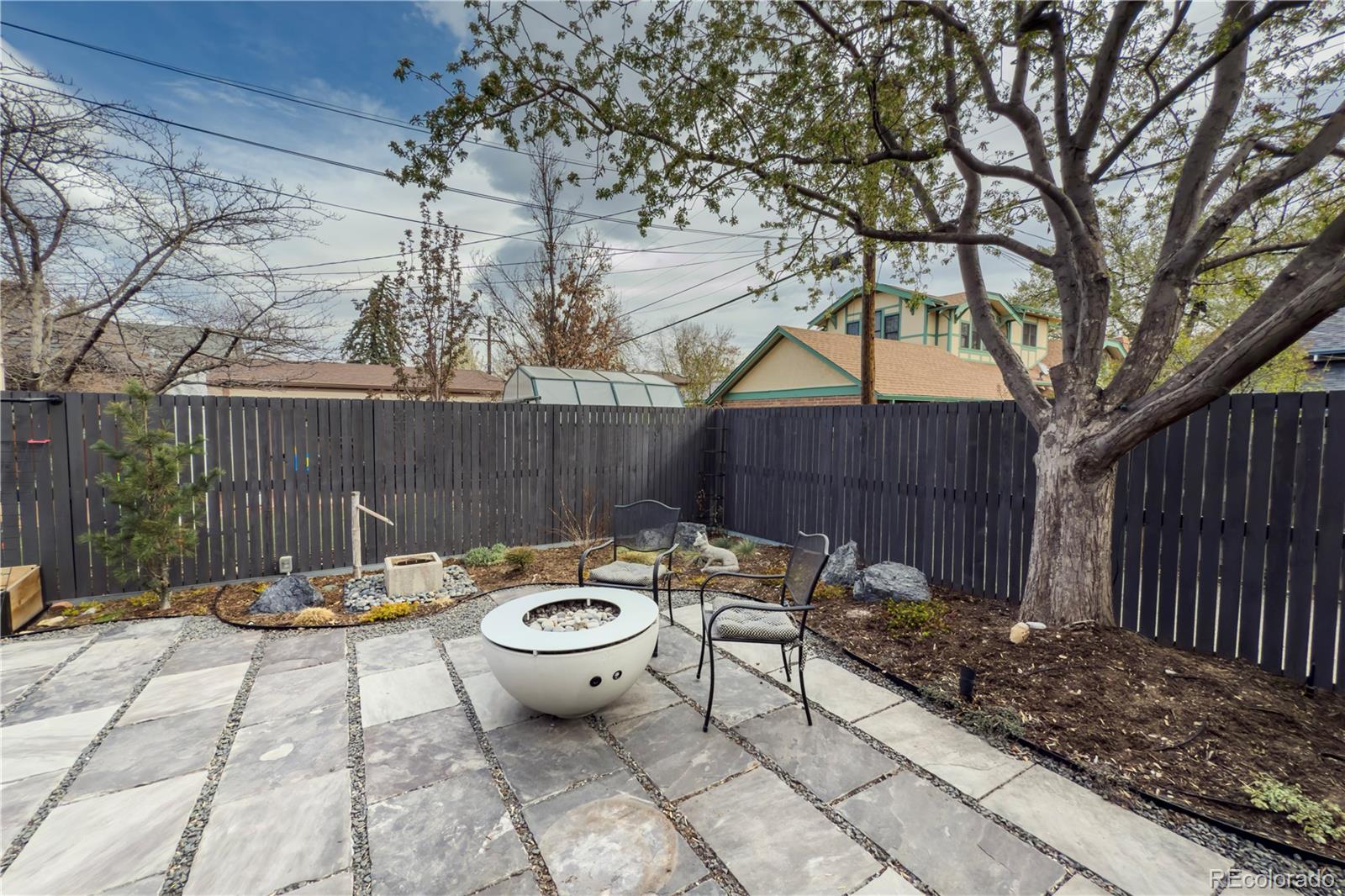 926 Steele Street Denver, CO 80206 - Photo 40 of 41 a view of a backyard with sitting area