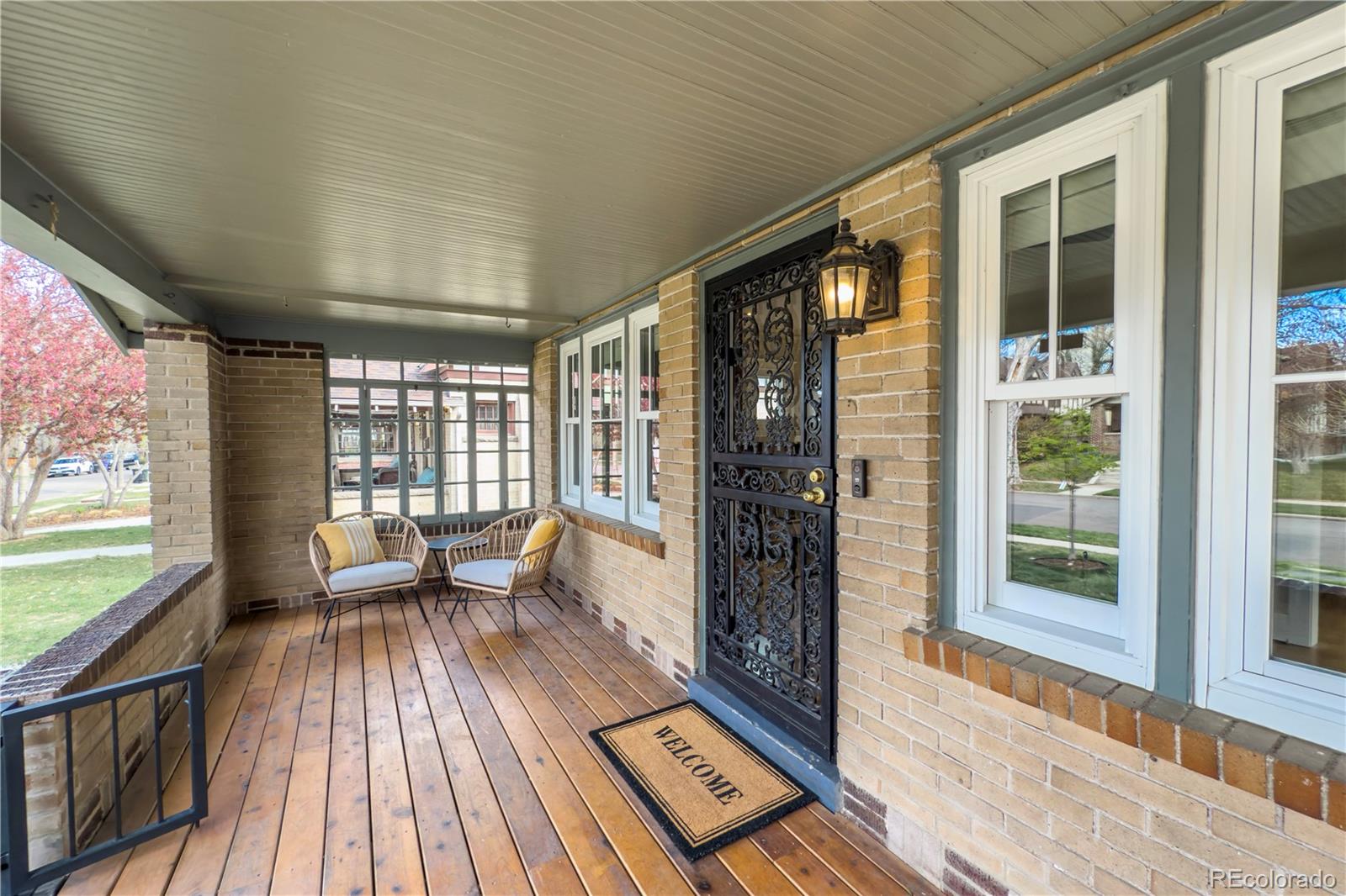 926 Steele Street Denver, CO 80206 - Photo 4 of 41 a view of a patio with wooden floor and iron stairs
