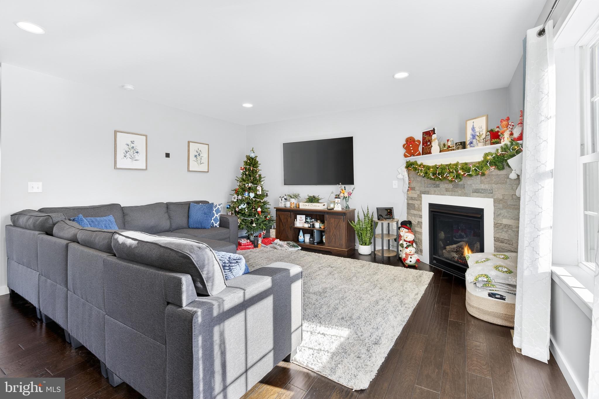 32 Katherines Way Lancaster, PA 17602 - Photo 11 of 42 a living room with furniture a fireplace and a flat screen tv