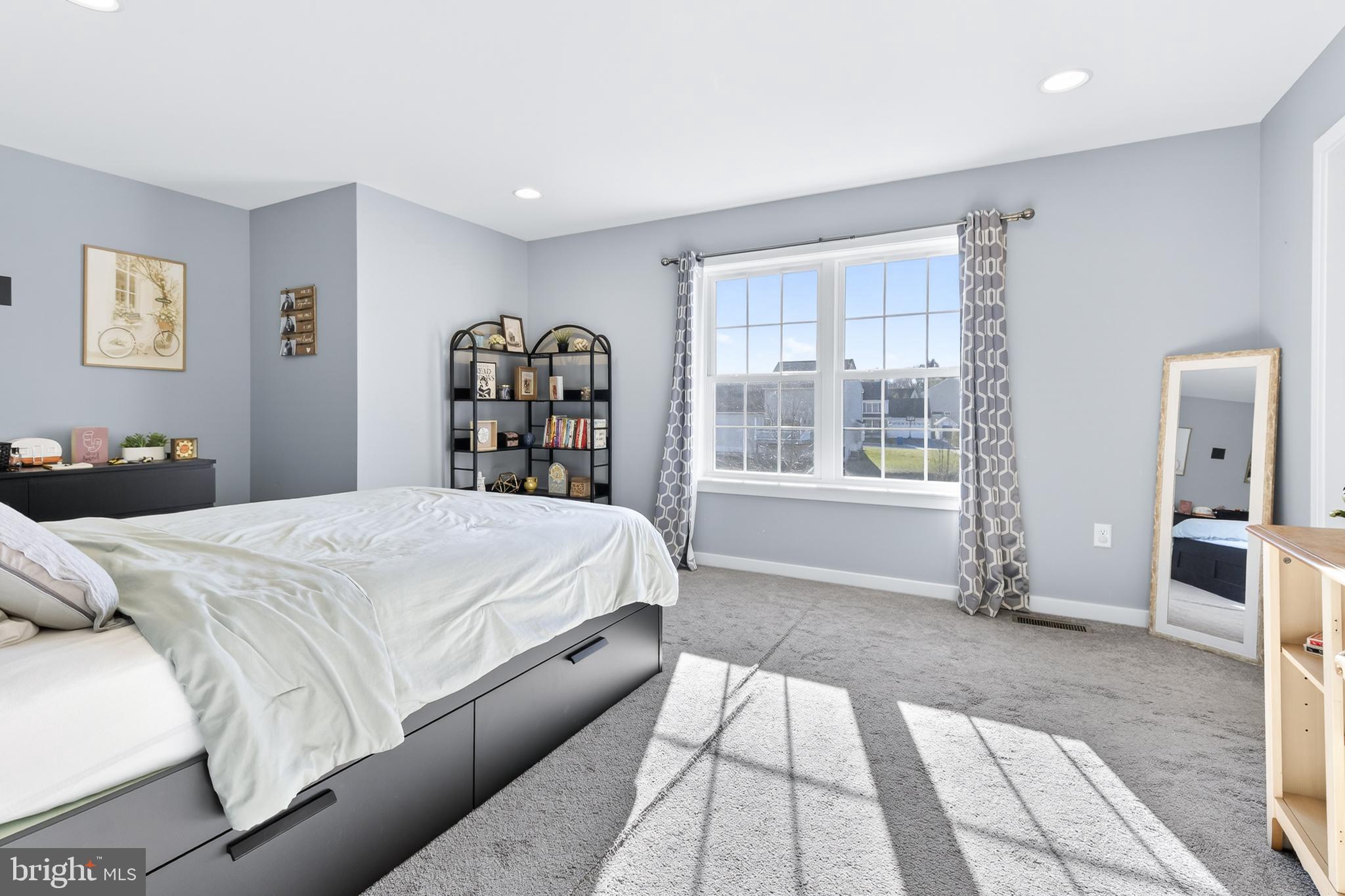 32 Katherines Way Lancaster, PA 17602 - Photo 22 of 42 a bed sitting in a bedroom next to a window