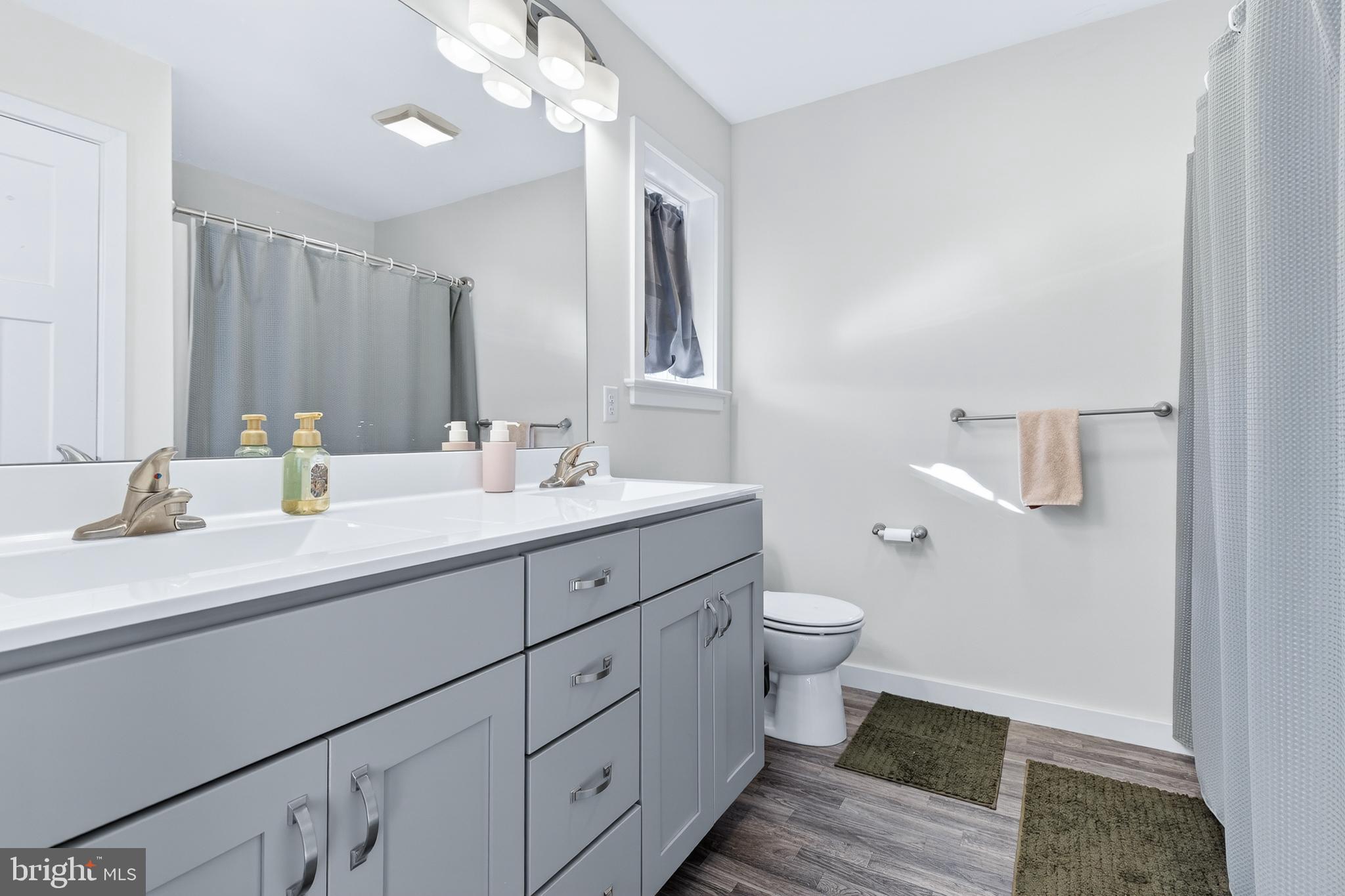 32 Katherines Way Lancaster, PA 17602 - Photo 24 of 42 a bathroom with a double vanity sink toilet and a mirror