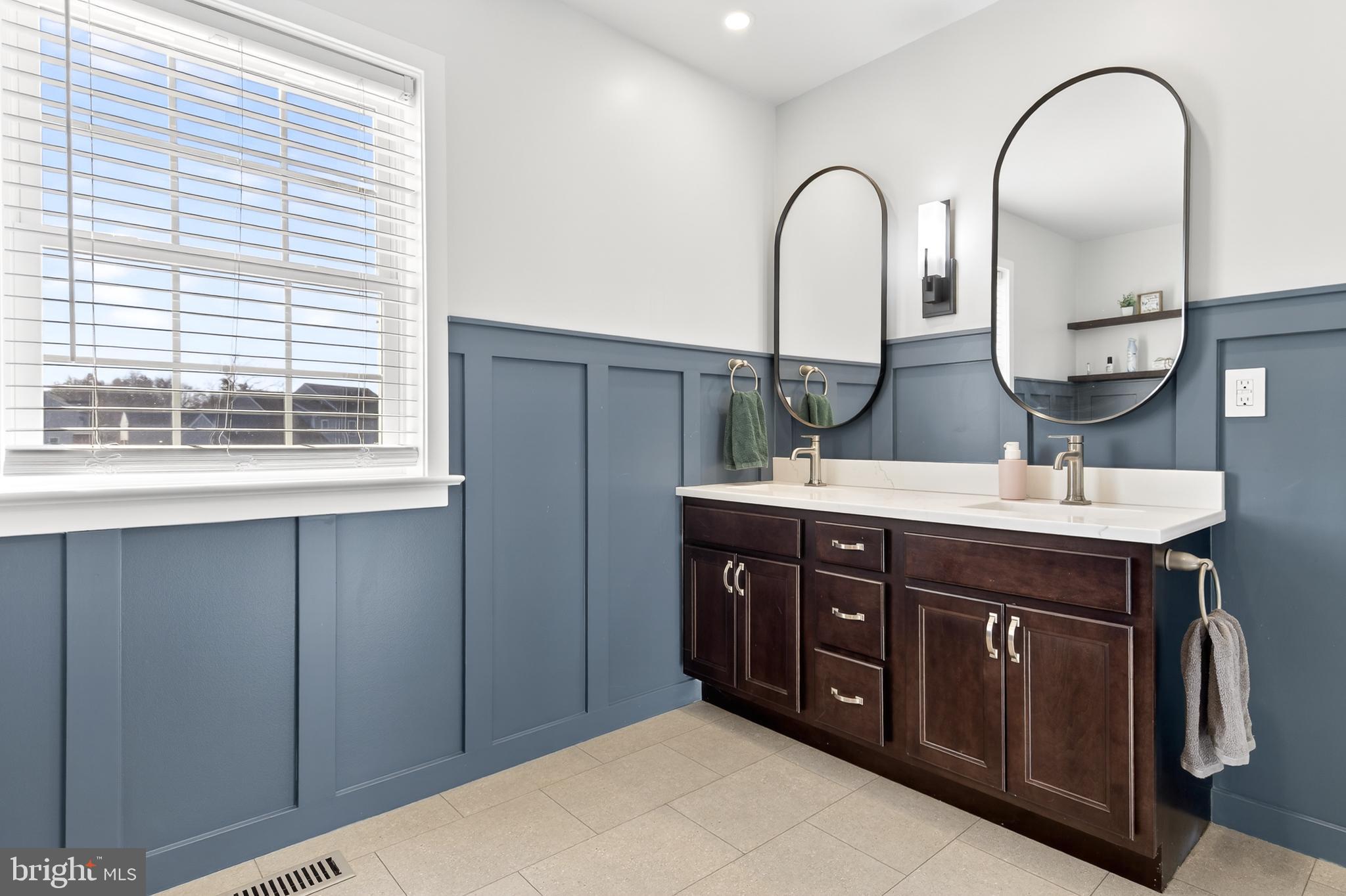 32 Katherines Way Lancaster, PA 17602 - Photo 27 of 42 a bathroom with a double vanity sink and a window