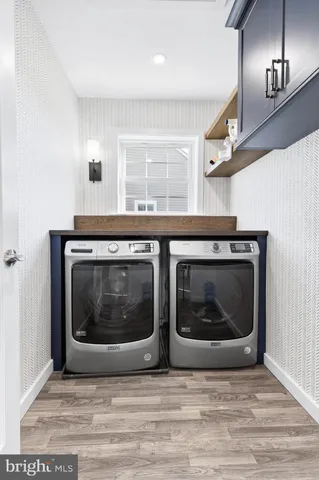 a white stove top oven sitting inside of a kitchen