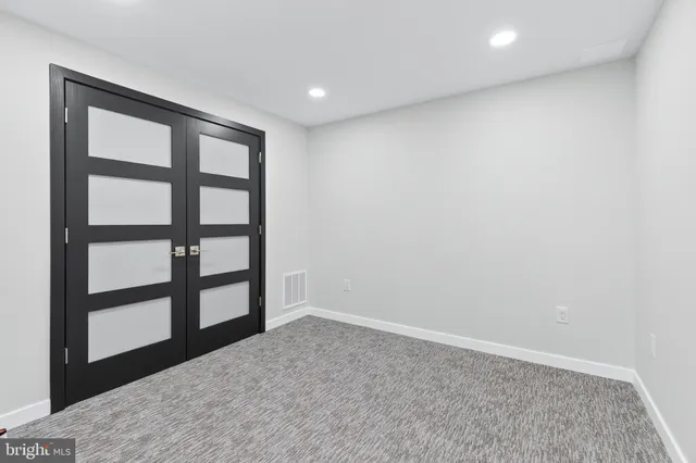 a view of empty room with windows