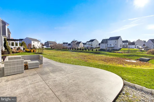 a view of a swimming pool and a yard