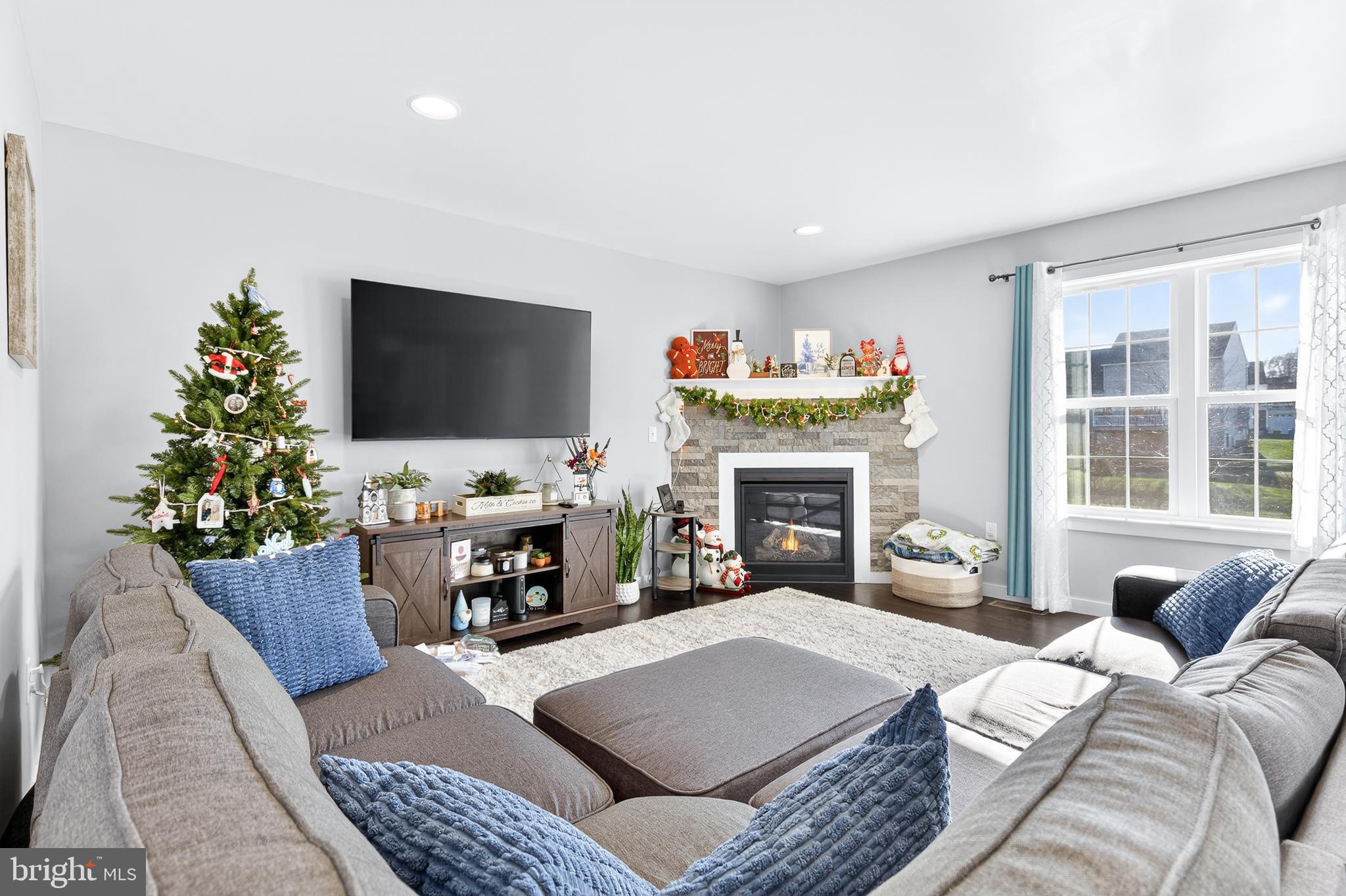 32 Katherines Way Lancaster, PA 17602 - Photo 10 of 42 a living room with furniture a fireplace and a flat screen tv