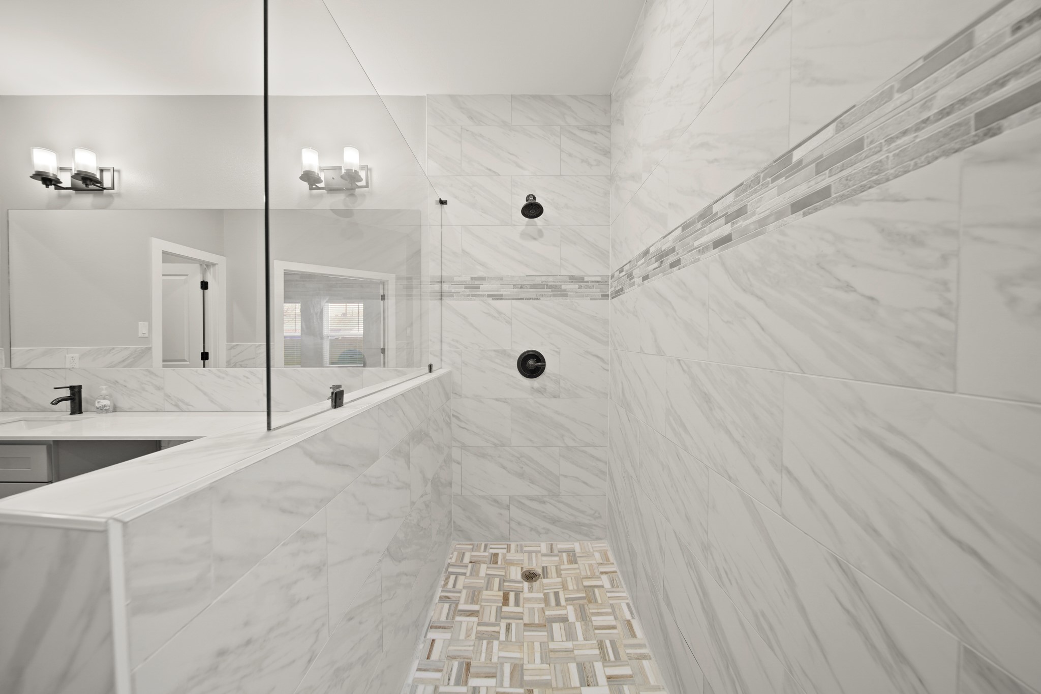 507 Carl Street Houston, TX 77009 - Photo 18 of 25 a bathroom with a tub shower vanity and a sink