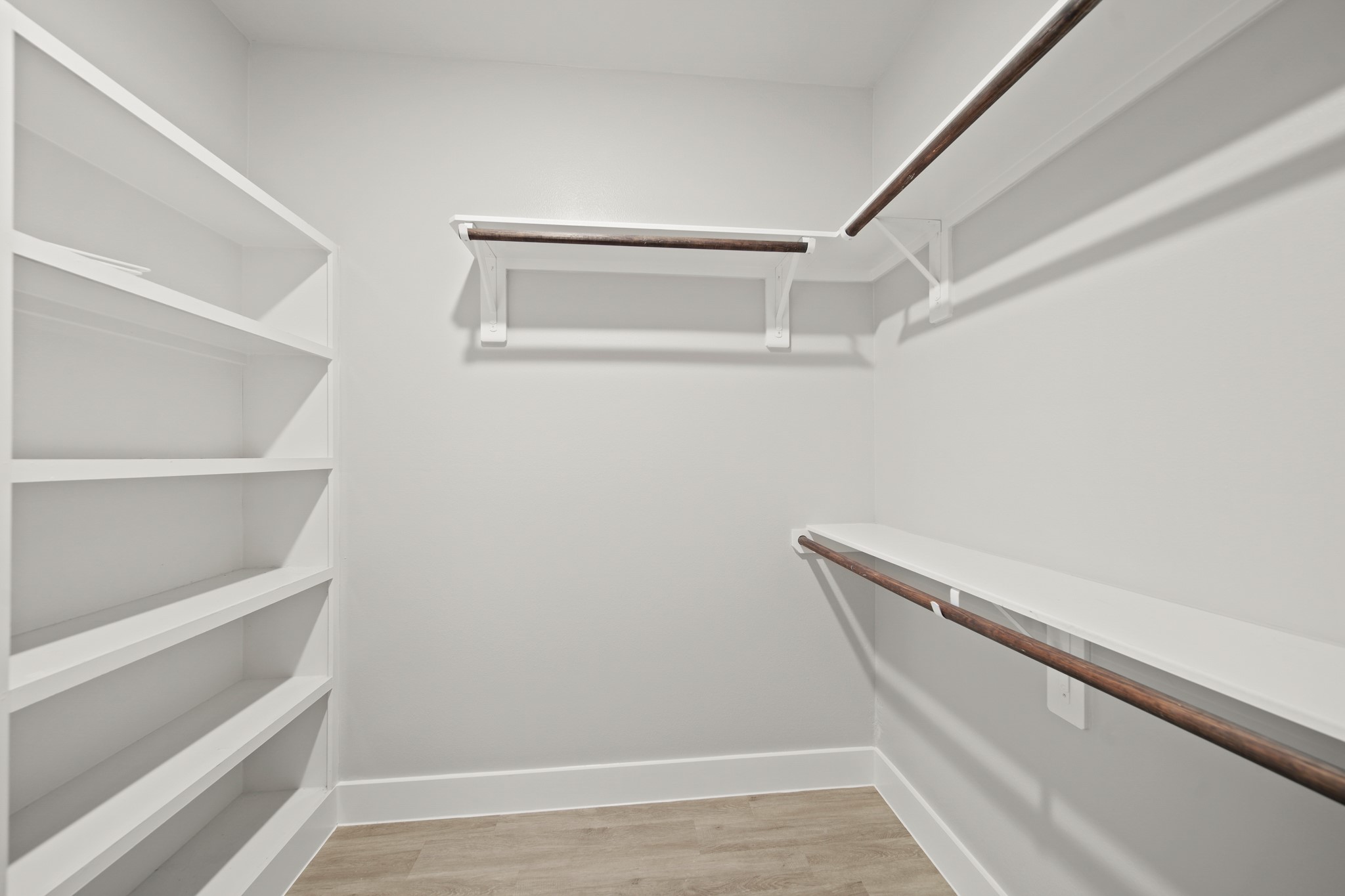507 Carl Street Houston, TX 77009 - Photo 19 of 25 a view of walk in closet with empty racks