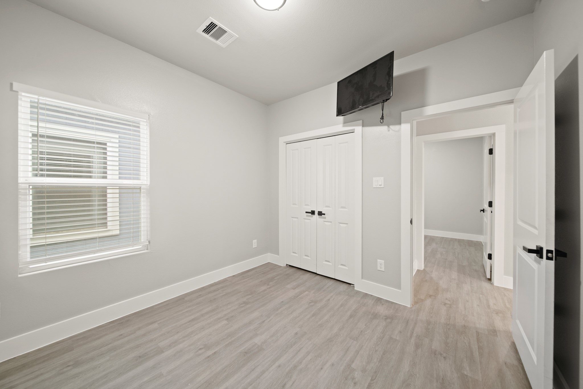 507 Carl Street Houston, TX 77009 - Photo 22 of 25 a view of a livingroom with an empty space and a window