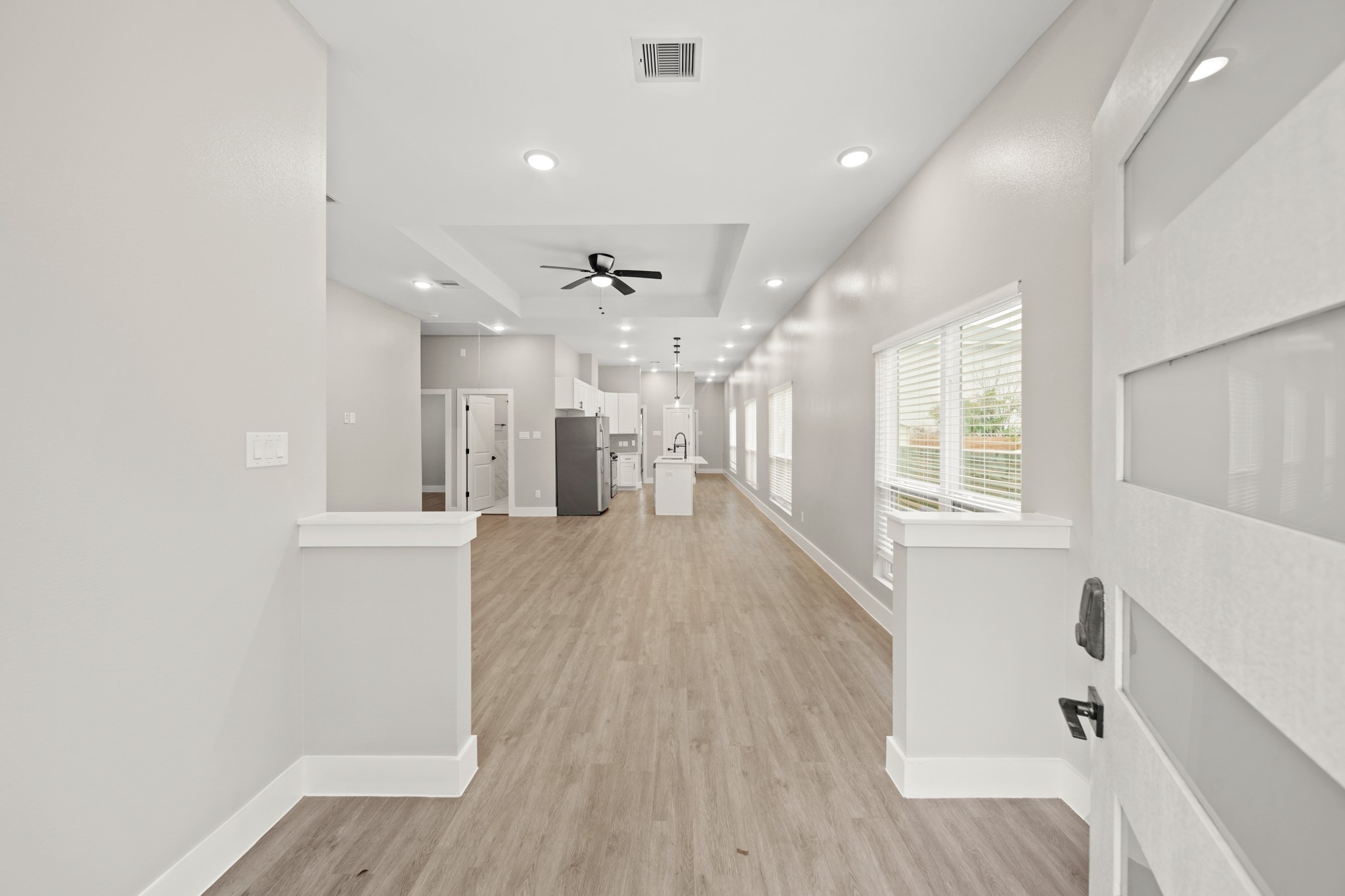 507 Carl Street Houston, TX 77009 - Photo 4 of 25 a view of kitchen and hall with wooden floor