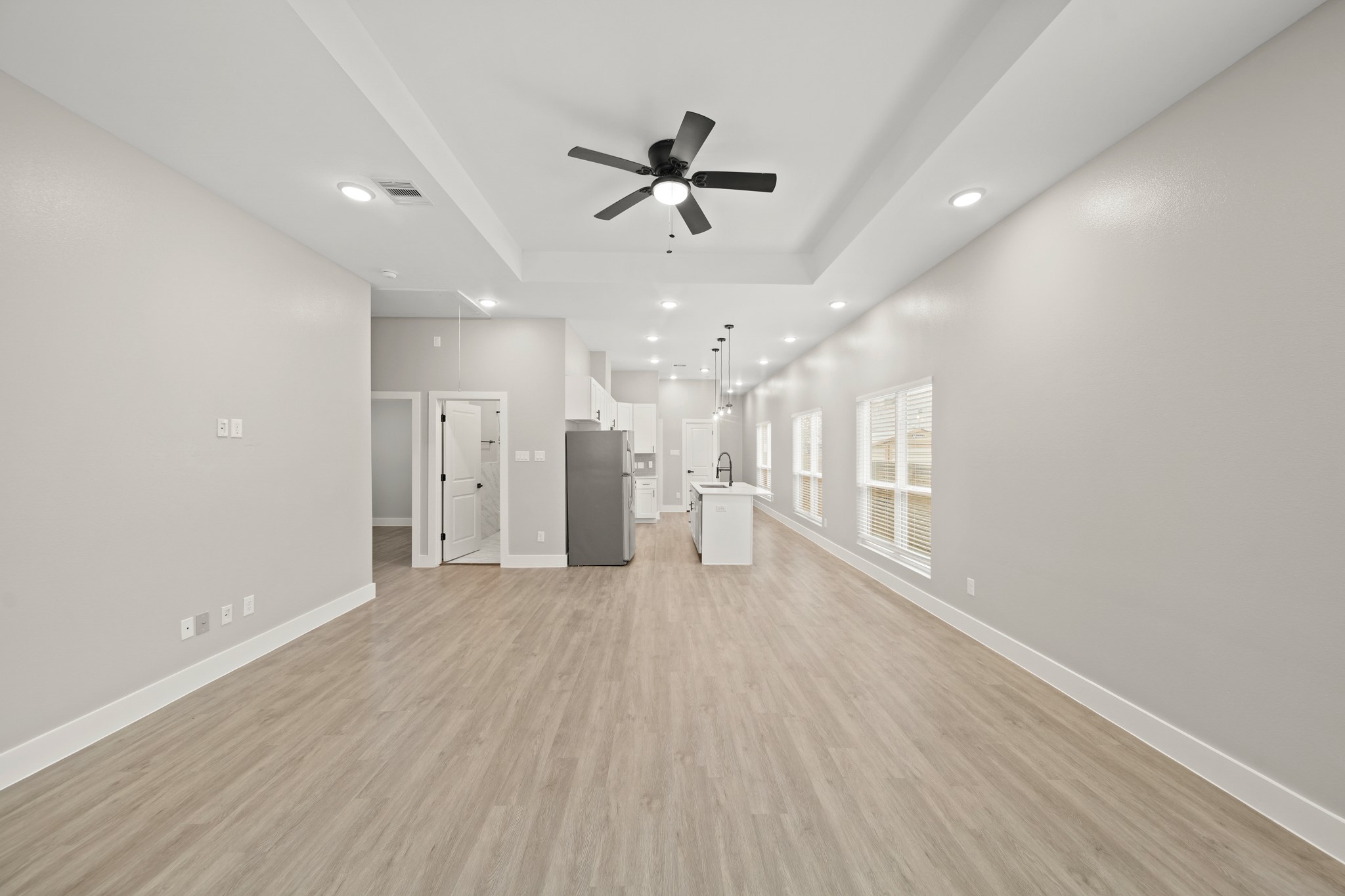 507 Carl Street Houston, TX 77009 - Photo 5 of 25 a view of an empty room with wooden floor and a window