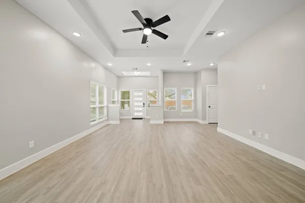 a view of a kitchen with a sink and wooden floor