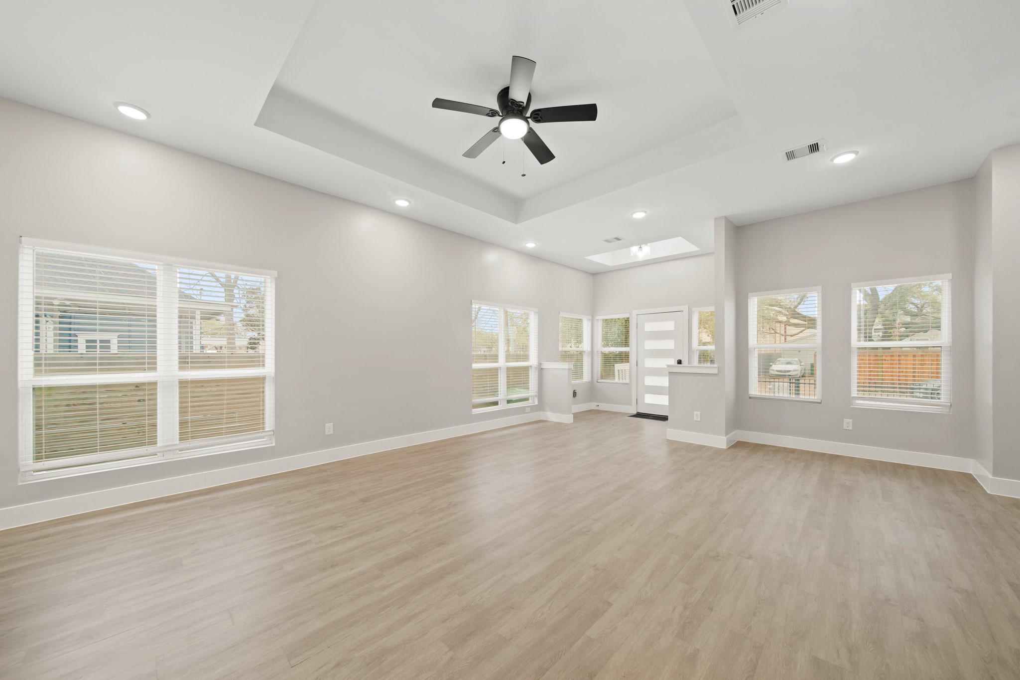 507 Carl Street Houston, TX 77009 - Photo 8 of 25 a view of an empty room with a window and wooden floor