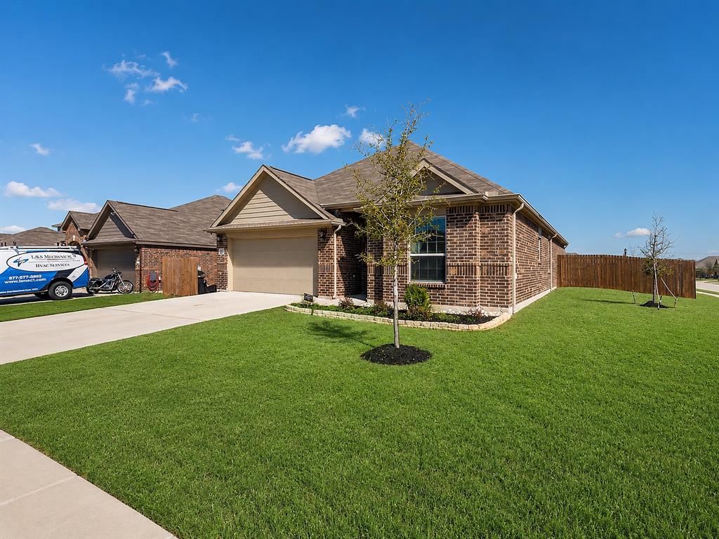 1837 Rialto Lane Crowley, TX 76036 - Photo 23 of 24 Brick exterior with a gabled roof and a two-car garage